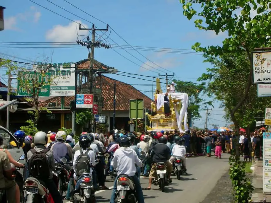 motor scooters waiting for a Balinese cremation