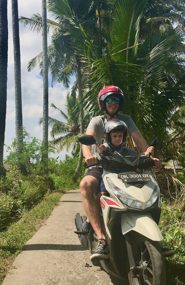 Driving a motor scooter on the Kajeng Rice Field Walk in Ubud