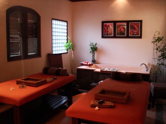 Balinese massage room with flower petal bath in Ubud