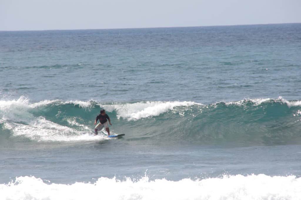 a surfer having fun at one of the waves at Balangan 