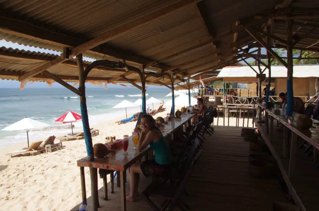 drinking fresh juice at a warung at the beach