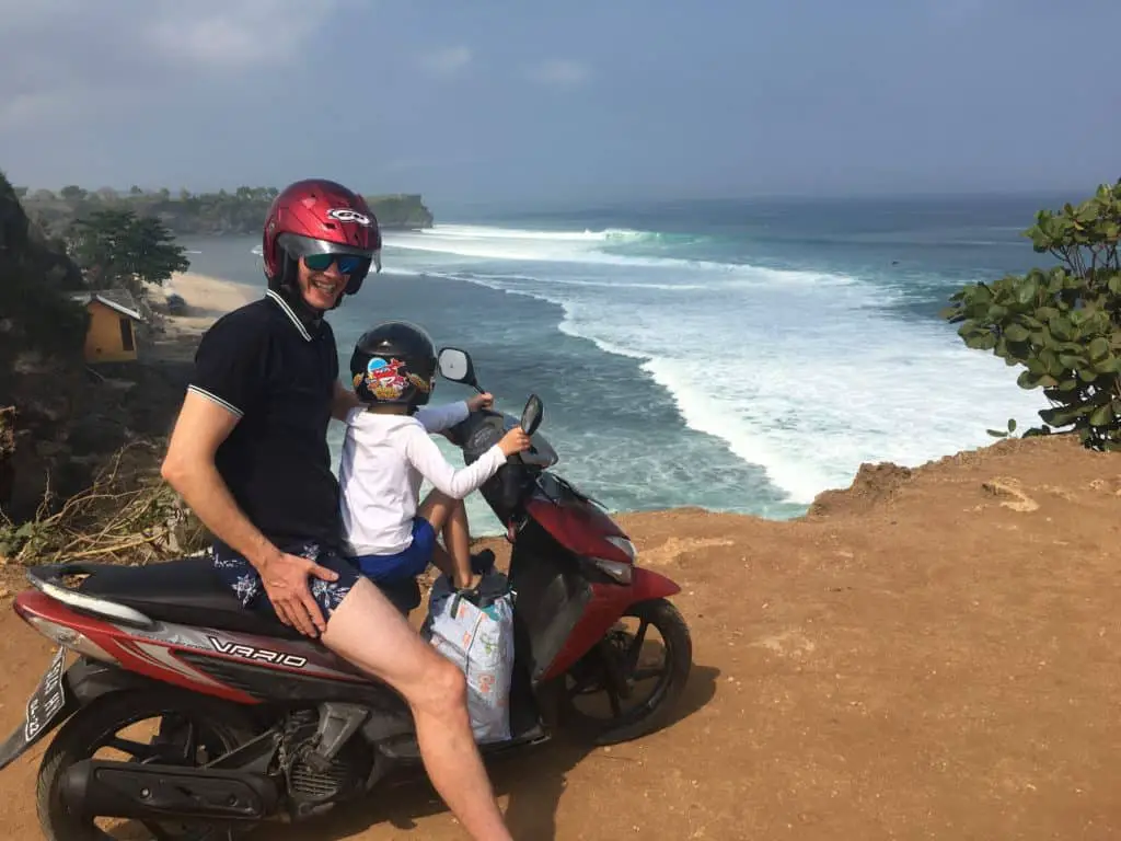 with the motor bike at the cliff at Balangan Beach