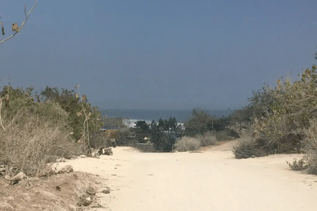 white limestone dirt road leading to the restaurants at Balangan