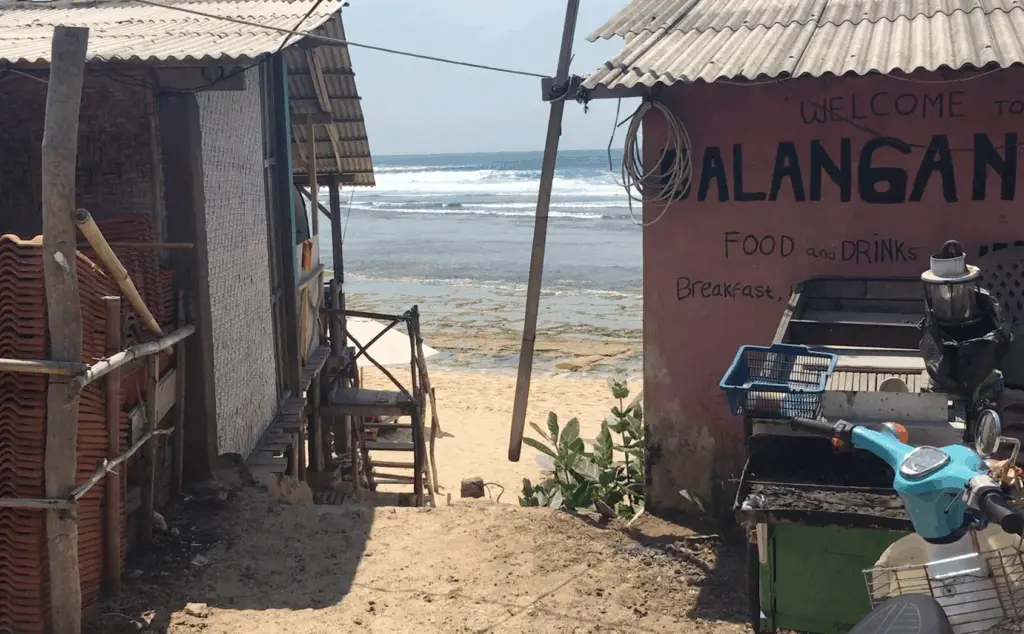 view on Balangan beach between two warung restaurants