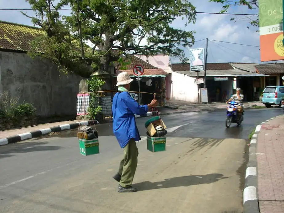 Shoemaker crossing the street in Ubud