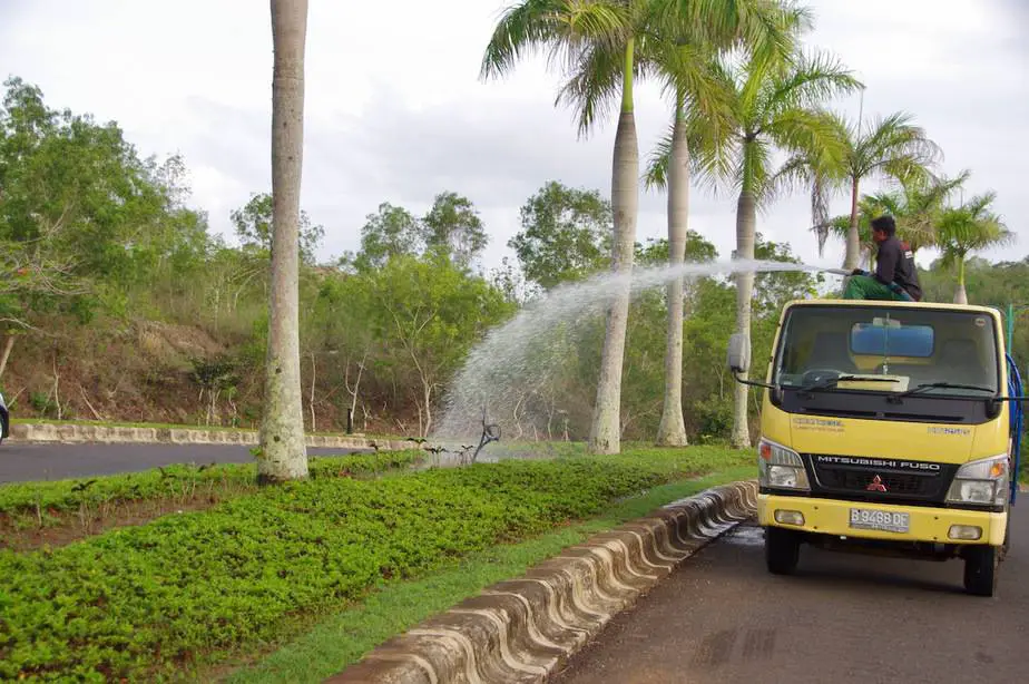 watering the plants from a water truck at the New Kuta Golf course