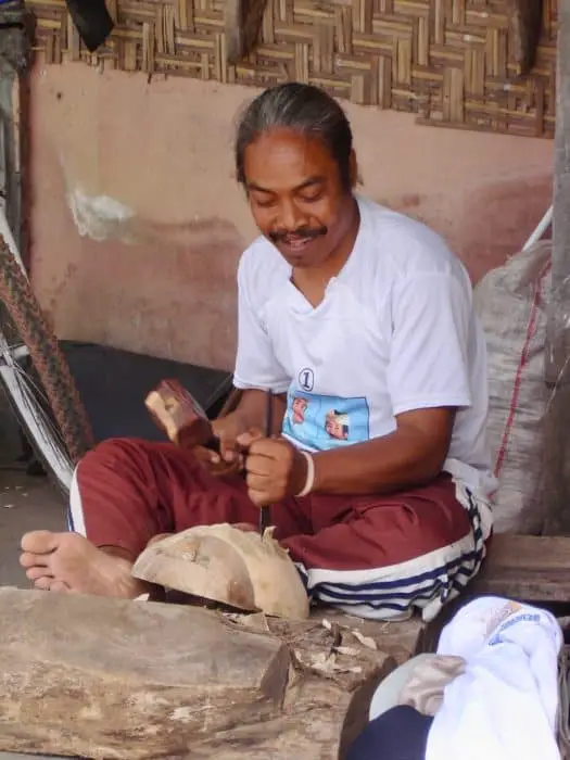 woodcarver in Mas village working on a Balinese mask