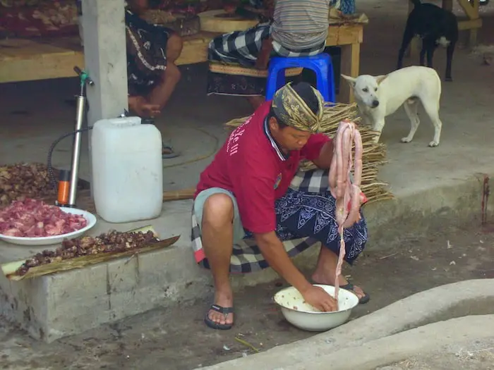 preparing traditional Balinese food such as  lawar at the goa gajah temple