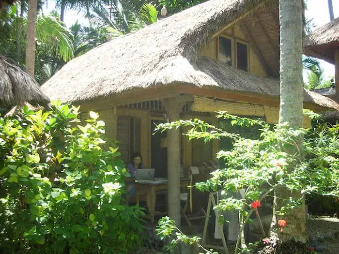 bungalow under the palm trees at ida's homestay