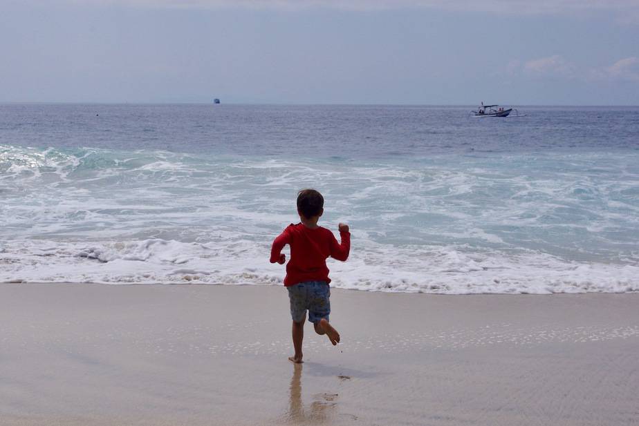 running into the ocean at Bias Tugel Beach