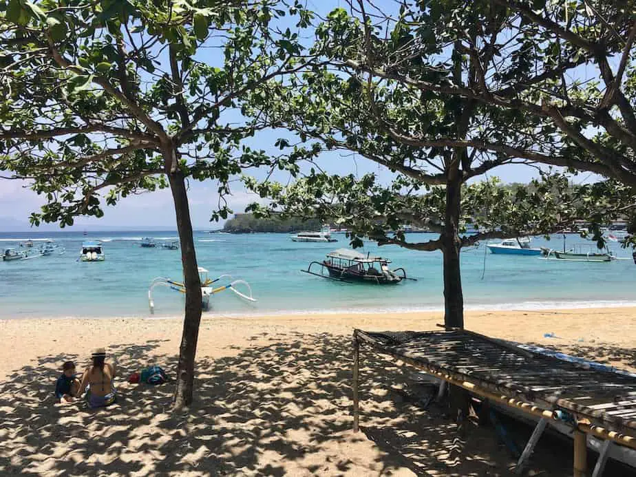 relaxing under the trees at padangbai beach