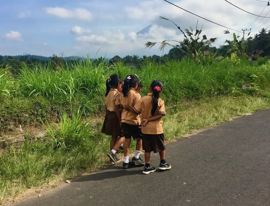 children coming out of school while we are doing one of the day trips in East Bali