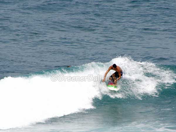 surfing at bali uluwatu 