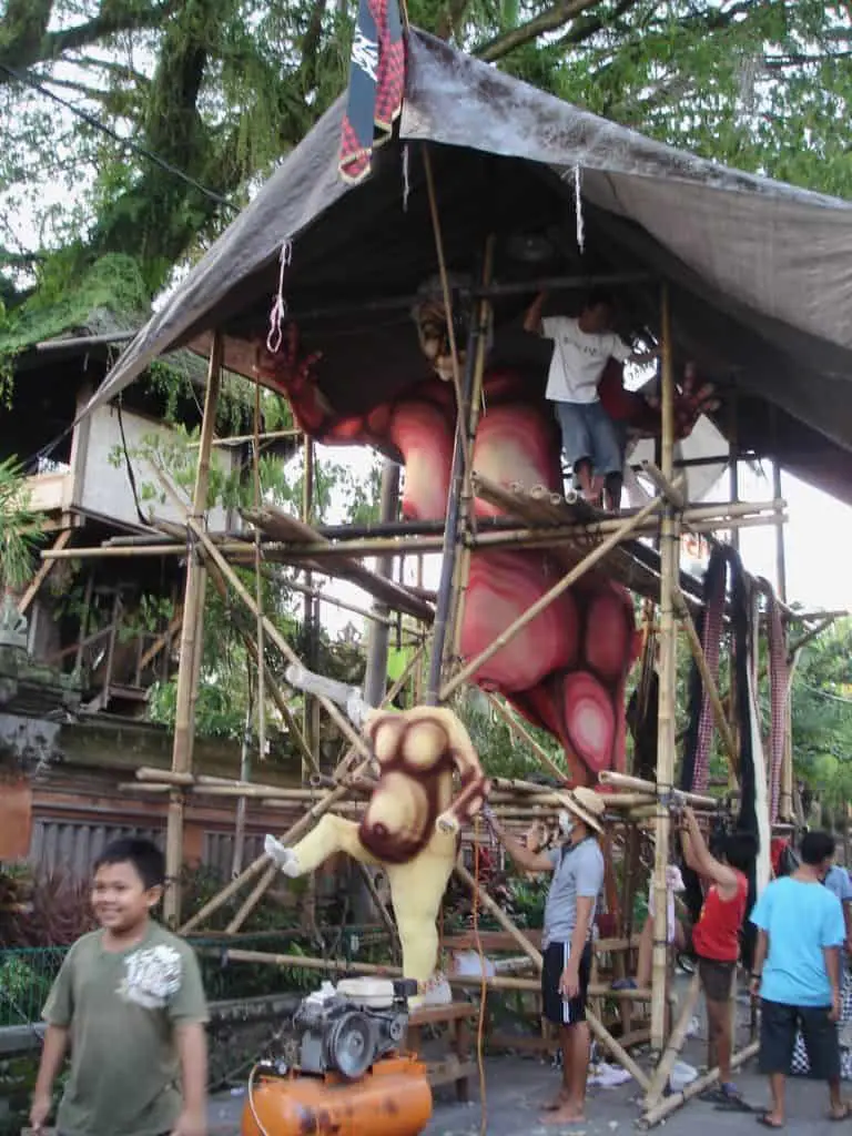 balinese men working on the ogoh ogoh monster just before nyepi day