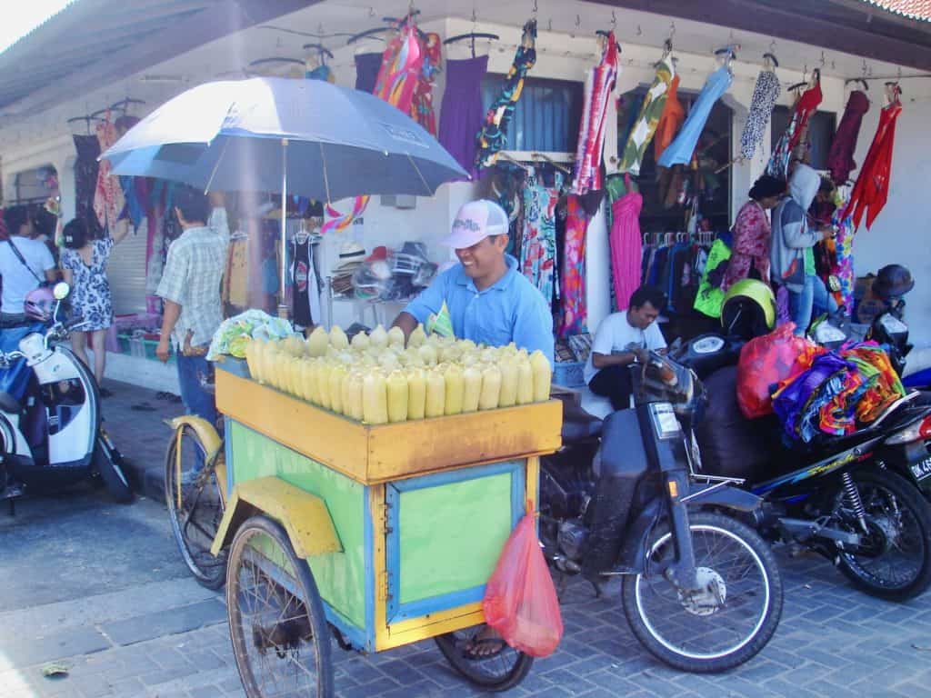 balinese man selling corn