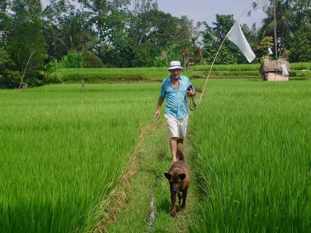 Victor Mason walking in the rice fields outside of Ubud