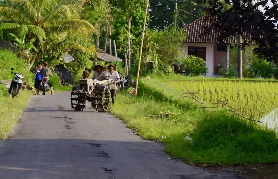 a Balinese farmer with his rice field machinery outside of Ubud