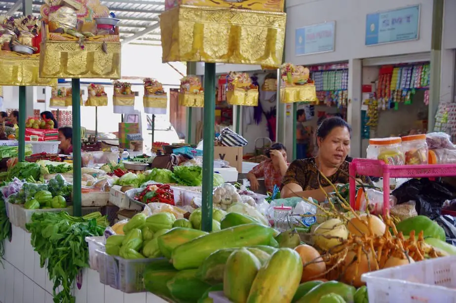 Balinese woman selling vegetables at the Sindhu market in Sanur