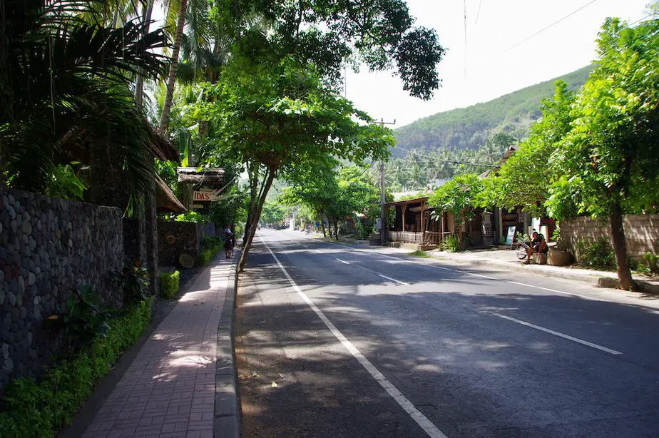 trees hanging over the road in Candidasa Beach