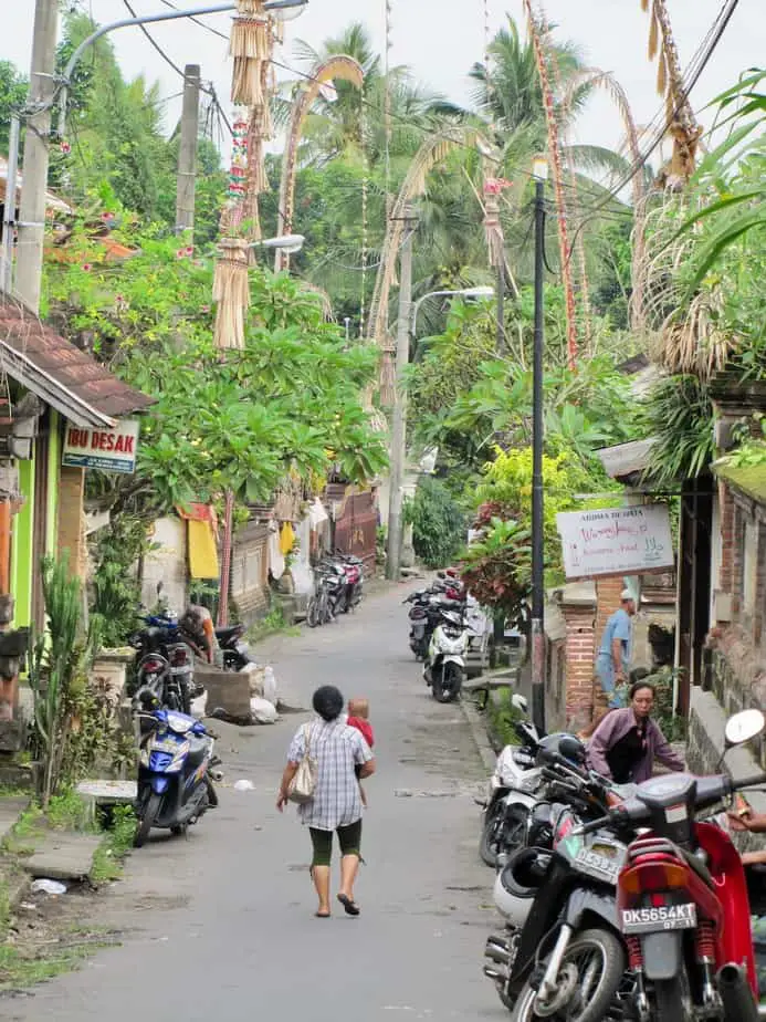 Balinese woman carrying a baby on one of the streets in Ubud