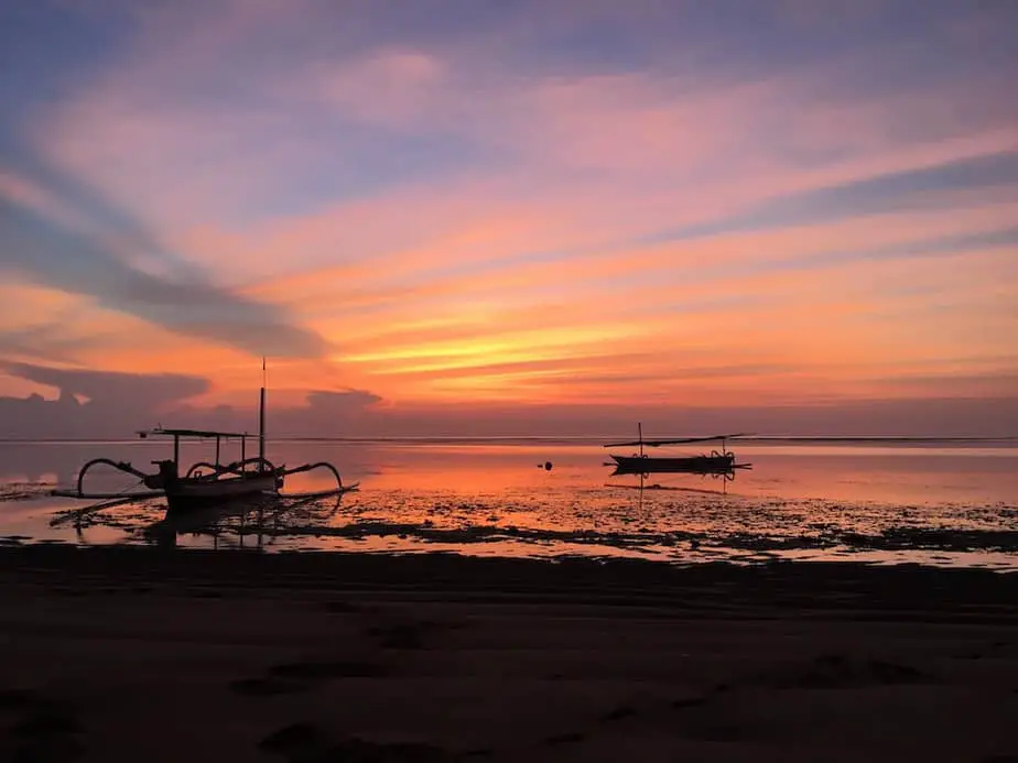 early sunrise in Sanur with two traditional boats