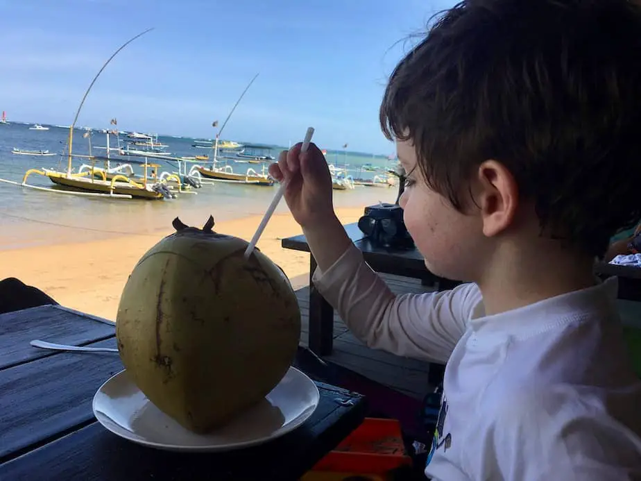 sipping coconut at Duyung Beach