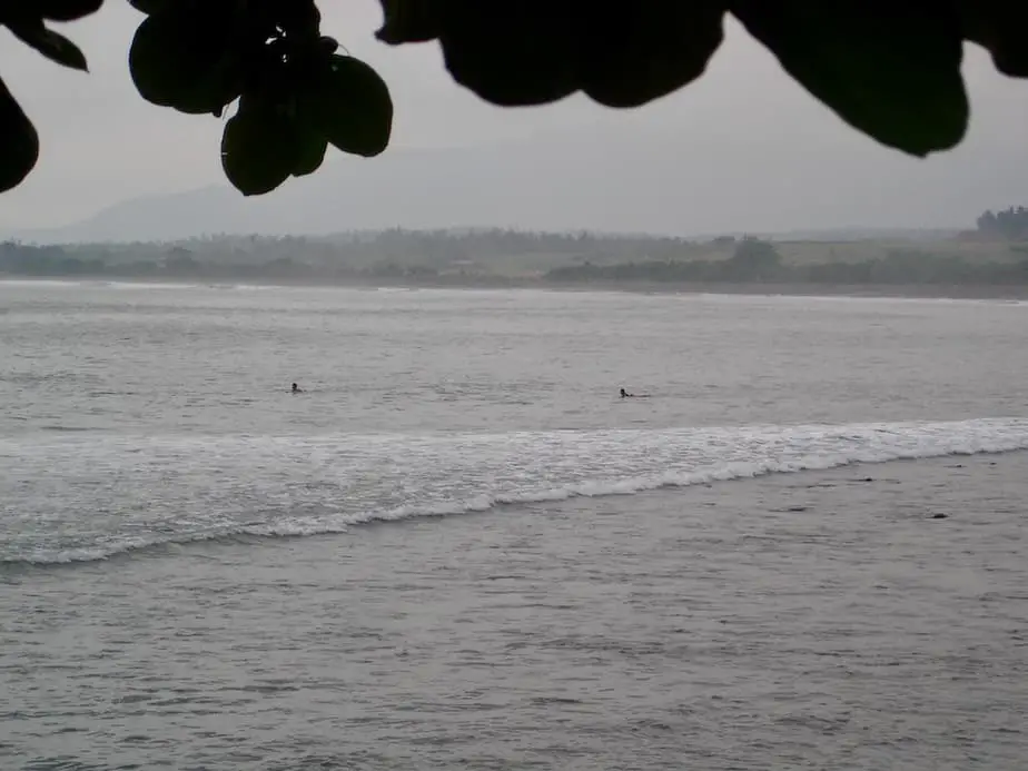 surfers waiting to catch the next wave at Medewi Beach