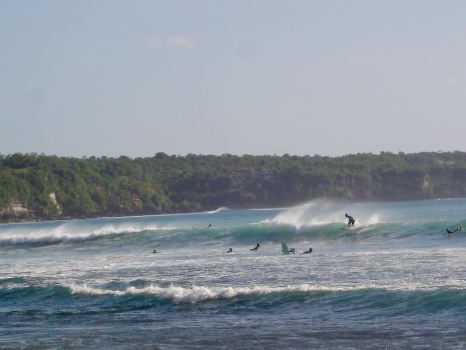 surfers on the waves at Dreamland Beach also known as New Kuta Beach