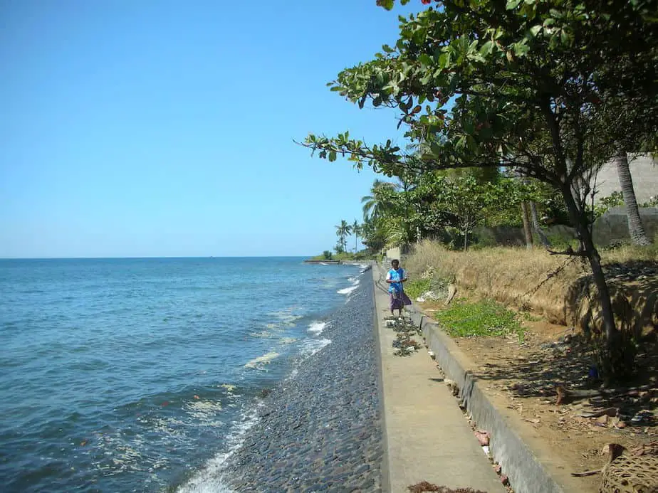 Balinese woman walking near the shore at Tulamben Beach