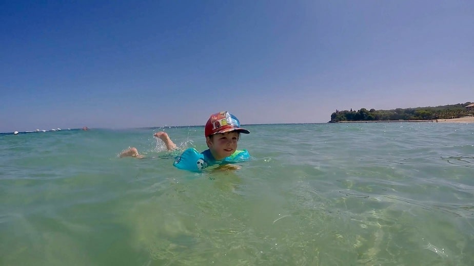 swimming at Geger Beach in Bali