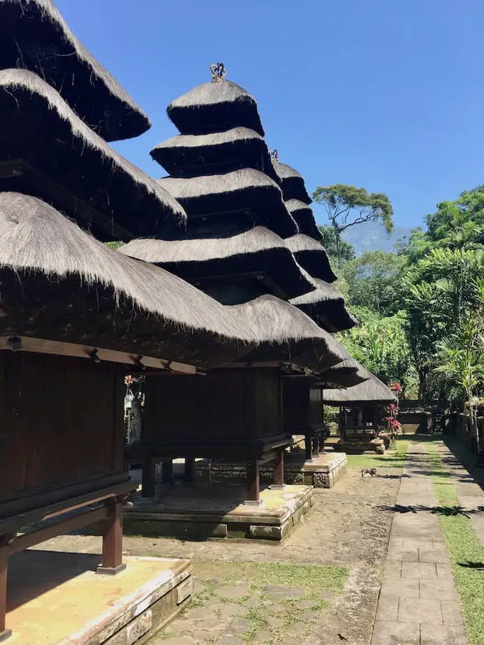 Thatched pagodas surrounded by forest in Bali