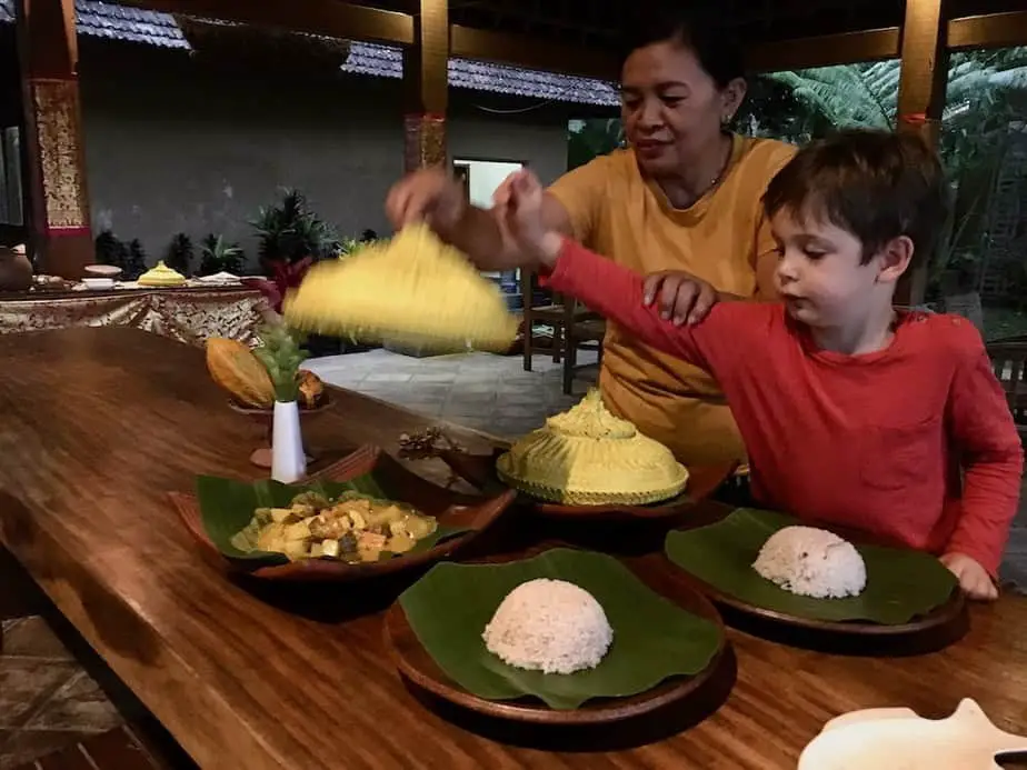 Ibu Santi serving delicious food at the Sari Devi Ecolodge