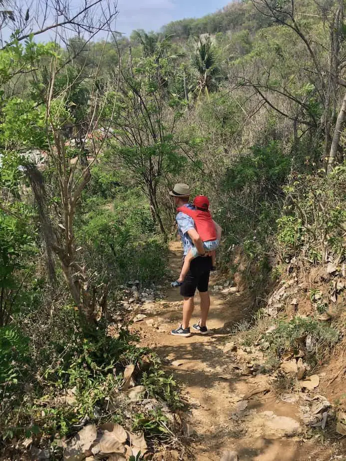 hiking on dirt tracks to get to one of the hidden beaches in Bali