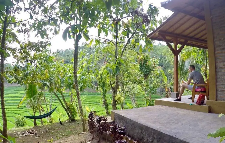 sitting on the verandah at one of the bungalows at the Sari Devi Ecolodge