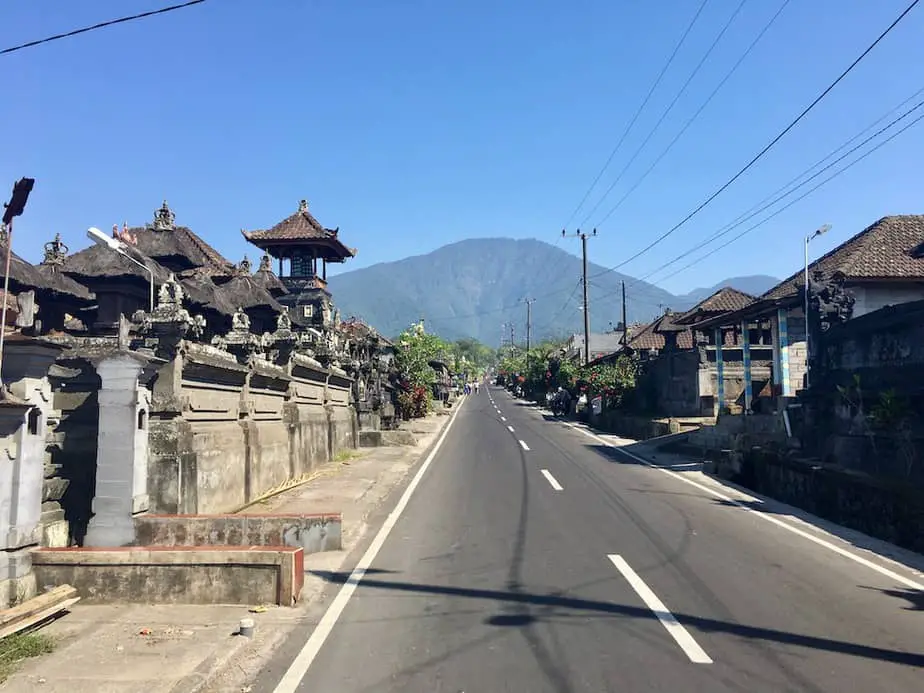 road through Wongayagede village with a view on Mount Batukaru