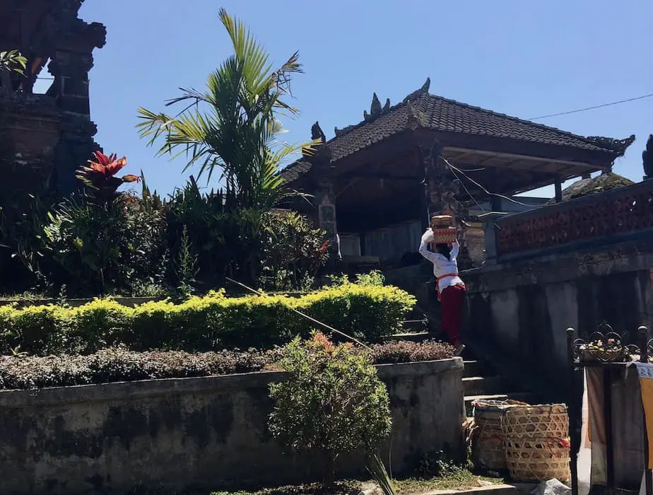 Woman walking into a Hindu temple in Bali