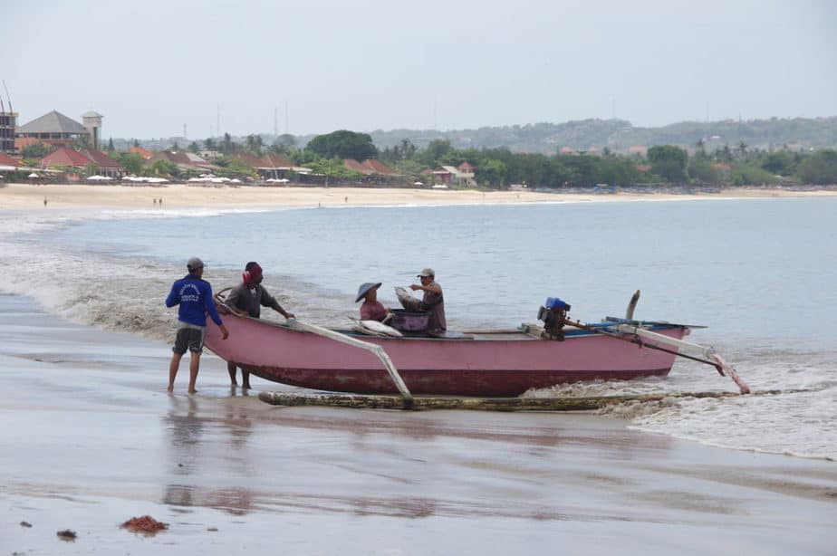 fishermen coming back with the morning catch in Jimbaran bay
