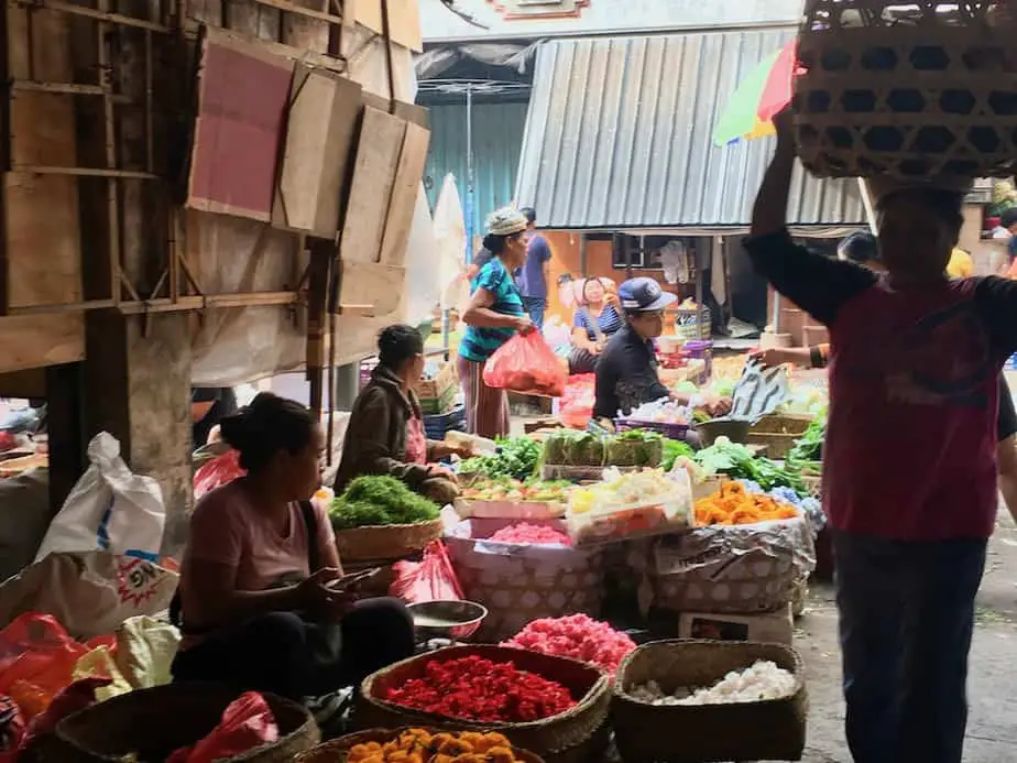 selling offerings and vegetables at the Ubud morning market