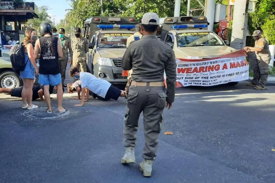 foreigners doing push-ups in Bali